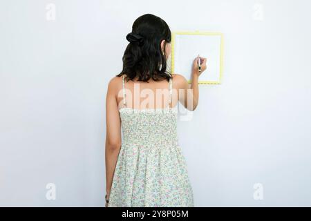 Young Asian Tutor Teacher with a white board teaching. Blank white board for English Language Stock Photo