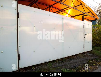 Hinged garage door made of cellular polycarbonate Stock Photo