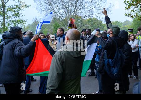 London, UK. 06th Oct, 2024. The British Jewish community expresses solidarity with Israel to mourn the victims and call for the release of the hostages still in captivity. Palestine supporters shouted 'Free Palestine' and waved a Palestinian flag at the jewish community who shouted back as there is increasing antagonism between the two groups Credit: Mary-Lu Bakker/Alamy Live News Stock Photo