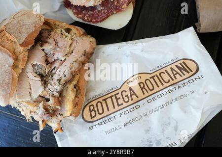 The “Antica Bottega Roticiani” is a traditional butcher in Orvieto, Italy.  Amazing porchetta sandwiches and other cured meats. Stock Photo