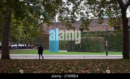 6 oct 2024 - londonuk : long view of the National Police Memorial through trees with one person walking past Stock Photo