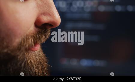 Happy computer scientist feeling satisfied after removing all bugs while coding on workstation desktop. Teleworking upbeat IT specialist pleased after solving script errors, camera B extreme close up Stock Photo