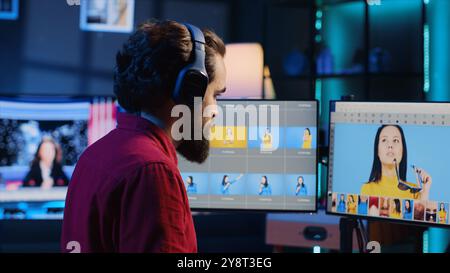 Photographer creating digital portfolio to showcase work after finishing photoshoot and editing images using retouching software. Photo editor selecting best photographs to promote himself Stock Photo