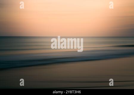 Evening ocean scene with soft waves and a serene horizon, abstract seascape Stock Photo