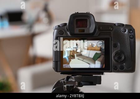 Interior of podcaster's studio with workplace, sofa and bicycle on camera screen, closeup Stock Photo