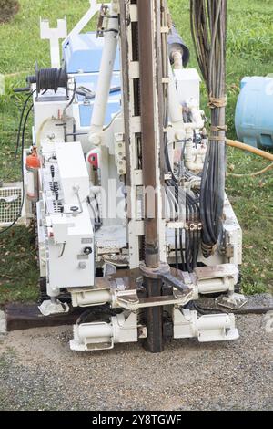 Well Working Machine Water well drill. Industrial machinery drilling with mining tower ...