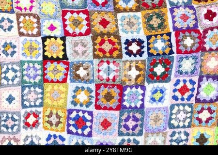Multi colored blanket in wool, geometric background, retro decorative pattern Stock Photo