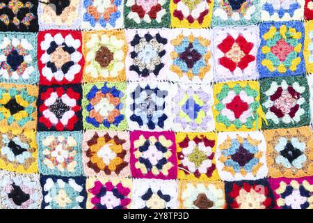 Multi colored blanket in wool, geometric background, retro decorative pattern Stock Photo