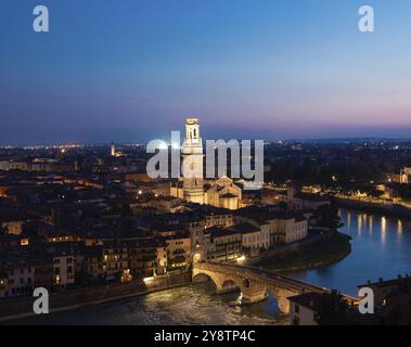 Verona, Italy, June 2022: panorama by night. Illuminated cityscape with scenic bridge, Europe Stock Photo