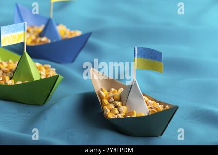 Ships with Ukrainian maize grain made of paper concept Stock Photo