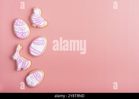 Homemade Easter cookies on pink background flat top view Stock Photo