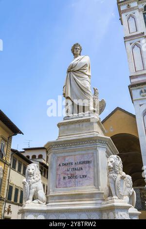 Dante Alighieri statue in Florence, Tuscany region, Italy, with an amazing blue sky background, Europe Stock Photo