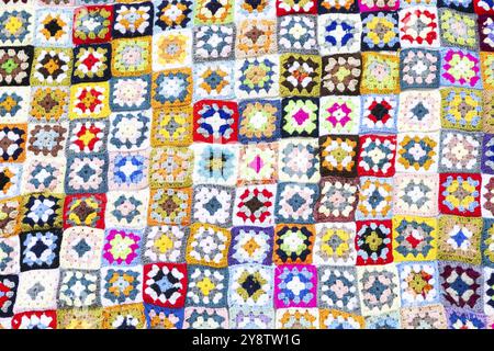 Multi colored blanket in wool, geometric background, retro decorative pattern Stock Photo