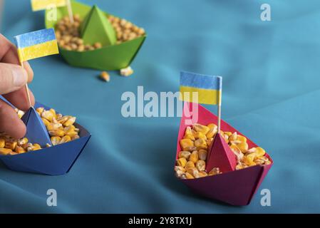 Ships with Ukrainian maize grain made of paper concept Stock Photo