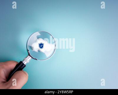 Cloud computing infrastructure technology, security data system storage service concept. Security shield on white small cloud on net grid focus in mag Stock Photo