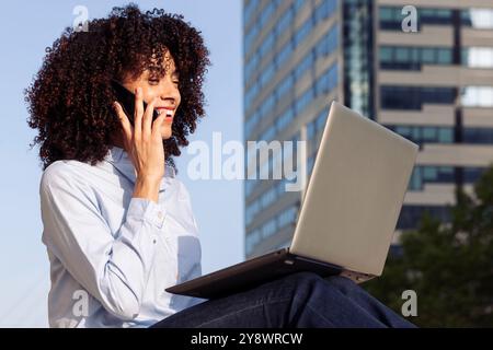 happy entrepreneur at city and working remotely Stock Photo