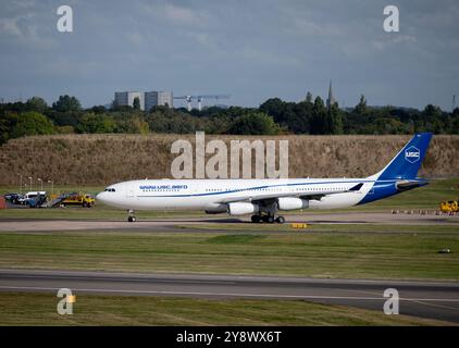 Universal Sky Carrier Airbus A340-313 taxiing at Birmingham Airport, UK (D-AUSC) Stock Photo