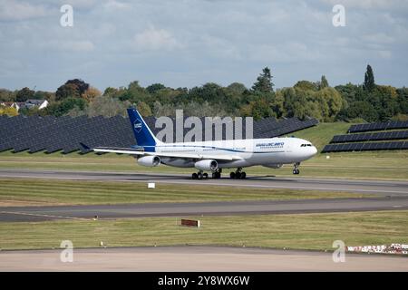 Universal Sky Carrier Airbus A340-313 taking off at Birmingham Airport, UK (D-AUSC) Stock Photo