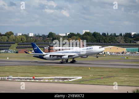 Universal Sky Carrier Airbus A340-313 taking off at Birmingham Airport, UK (D-AUSC) Stock Photo