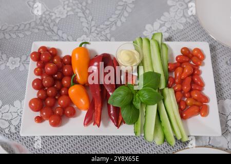 table tomatoes cucumbers sweet pepper basil cherry tomatoes cocktail tomato. vegetables Stock Photo