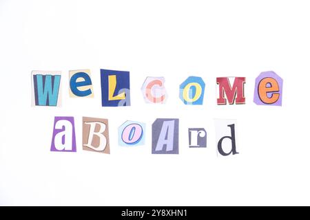 Welcome symbol. Concept words Welcome Aboard isolated on clean white background in fun cut out newspaper style typescript. Business, motivational Stock Photo