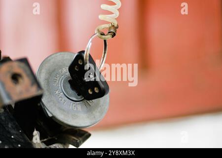 Close up of motorcycle key in ignition start lock Stock Photo