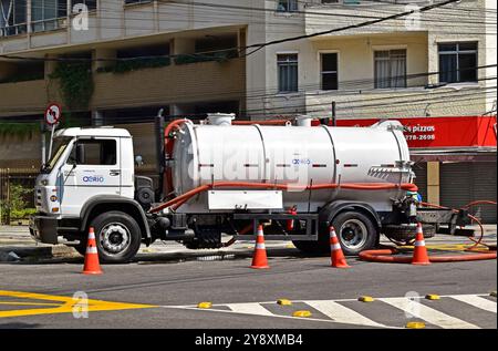 RIO DE JANEIRO, BRAZIL - August 31, 2024: Water supply company truck and workers making repairs in the Tijuca neighborhood Stock Photo