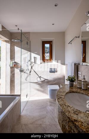Sunny bathroom with marble washbasin in Spanish villa, Mallorca. Stock Photo