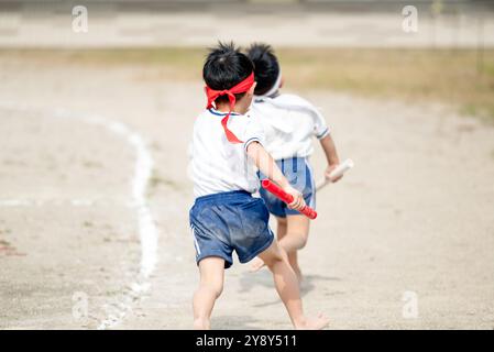 Japanese kids relay during school sports day in Japan. Stock Photo