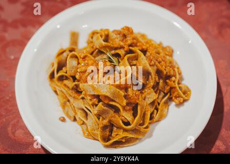 The Tagliatelle. The popular italian home made pasta. Here in the traditional ragù recipe. Stock Photo