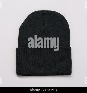 Black Beanie Hat on grey background Stock Photo