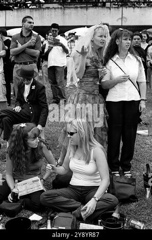 Wedding ritual a pre-wedding custom, girls day out together at Rose Hill Gardens horse racing track. The bride to be wears her white wedding veil. Sydney, Australia 2000 2000s HOMER SYKES Stock Photo