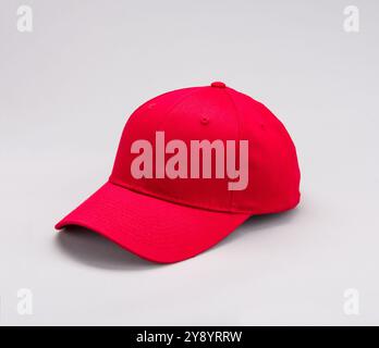 Side view  of Red Baseball cap on grey background Stock Photo