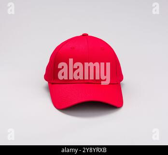 Front view  of Red Baseball cap on grey background Stock Photo