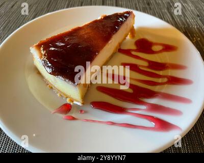 Cheese cake with strawberry syrup. Stock Photo
