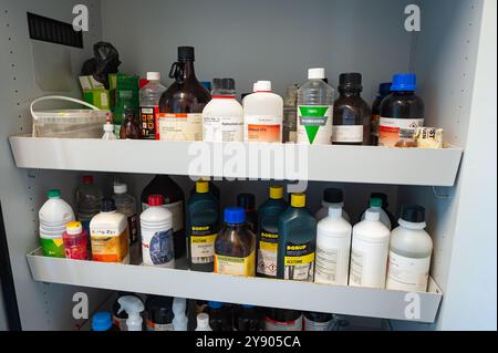 Stock cabinet of chemicals in a high school laboratory Stock Photo