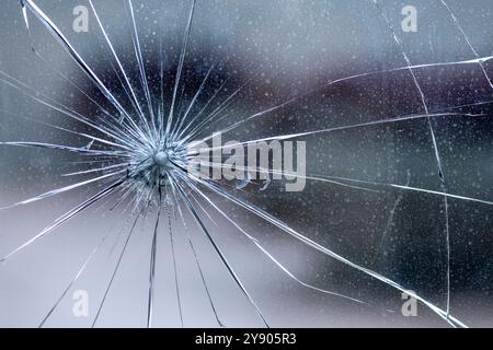 Cracked door glass in close-up. Stock Photo