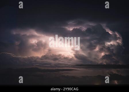 Thunderbolt and lightning on the stormy sea. Stock Photo