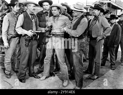 Audie Murphy (center), on-set of the western film, 'Drums Across The River', Universal Pictures, 1954 Stock Photo