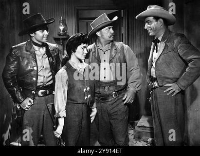 Audie Murphy (left), Susan Cabot, Walter Sande (2nd right), Stephen McNally (right), on-set of the western film, 'The Duel At Silver Creek', Universal Pictures, 1952 Stock Photo