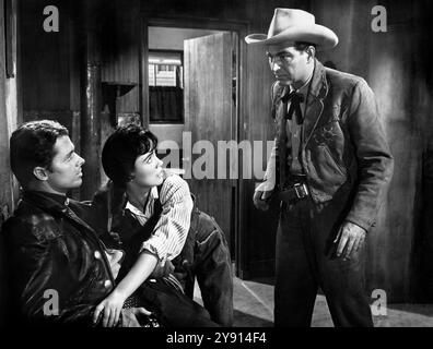 Audie Murphy (left), Susan Cabot, Stephen McNally (right), on-set of the western film, 'The Duel At Silver Creek', Universal Pictures, 1952 Stock Photo