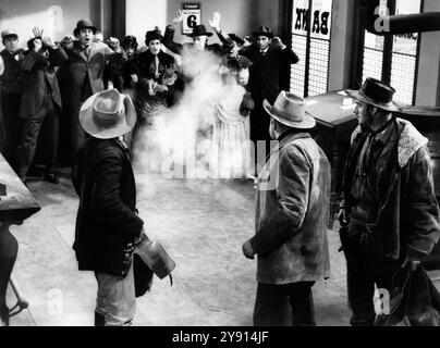 Noah Beery, Jr. (rear-view left), Broderick Crawford (rear-view center), John Dehner (rear-view right), on-set of the western film, 'The Fastest Gun Alive', MGM, 1956 Stock Photo