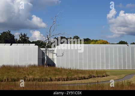 A stainless steel sculpture of a tree titled Askew is a prominent feature outside of the West Building of the North Carolina Museum of Art Stock Photo