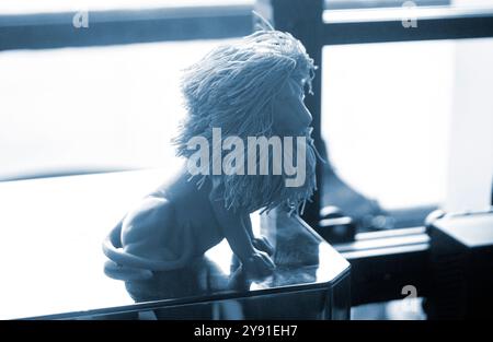 Art object blue lion printed on 3D printer. Abstract small toy model blue lion created on 3d printer. FDM 3D Printing technology. Concept new 3D Printing. Additive modern new progressive technologies Stock Photo