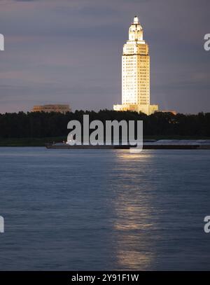 Vertical composition covering the Mississippi River waterfront barge traffic and the State Capitol of Louisiana at Baton Rouge Stock Photo