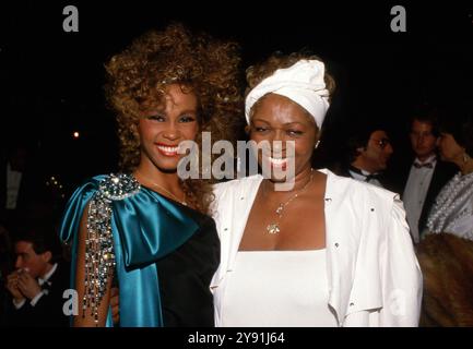 **FILE PHOTO** Cissy Houston Has Passed Away. Whitney Houston and Cissy Houston at the 13th Annual American Music Awards on January 27, 1986 at Shrine Auditorium in Los Angeles, California Credit: Ralph Dominguez/MediaPunch Stock Photo