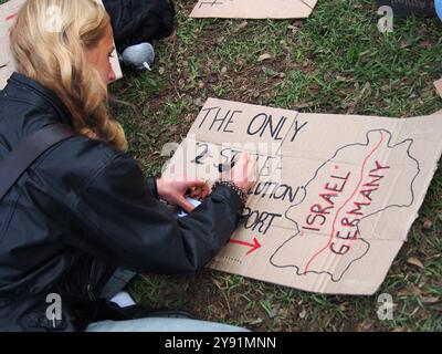 Lima, Peru. 07th Oct, 2024. 'The only 2-state solution is Israel/Germany' can be read on a cardboard when dozens of demonstrators took to the streets in Lima in solidarity with Palestine and Lebanon to mark the first anniversary of the war between Israel and Hamas, which began on October 7th, 2023, when Hamas killed and abducted Israelis at the Nova music festival. Credit: Fotoholica Press Agency/Alamy Live News Stock Photo