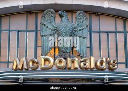 Porto, Portugal 29 January 2011. Gold, bronze McDonald's Imperial restaurant logo with bronze eagle in Porto Portugal. The building is in Art deco sty Stock Photo