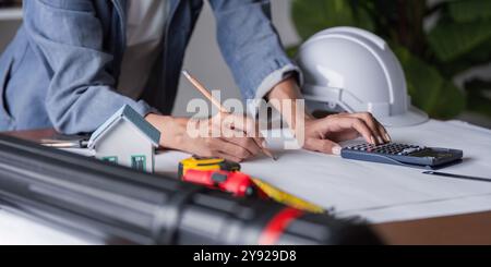 Engineer Conducting Measurements for Structural Design and Execution Stock Photo