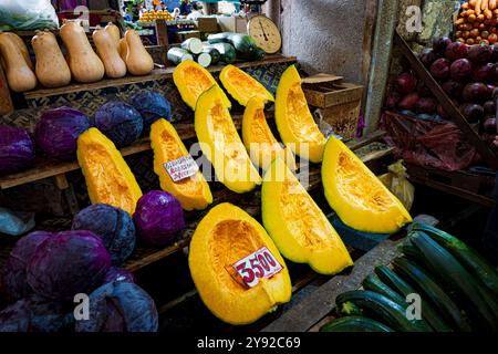 Beautiful view of fresh, delicious-looking pumpkins, cabbage, zucchini, and other vegetables at a farmers' market in Port Louis, Mauritius, Africa Stock Photo